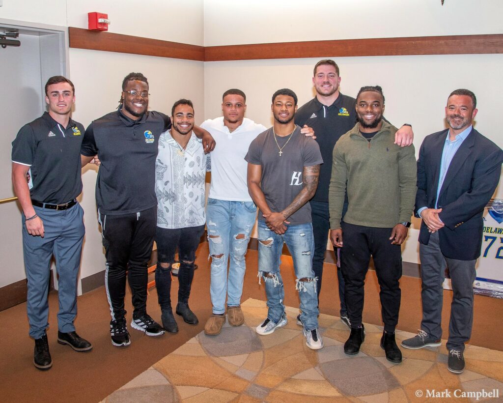 The captains, from L to R: Nolan Henderson, Frank Burton III, Dejoun Lee, Gene Coleman II, Nijuel Hill, David Kroll, Kedrick Whitehead, Strength & Conditioning Coach Chris Stewart